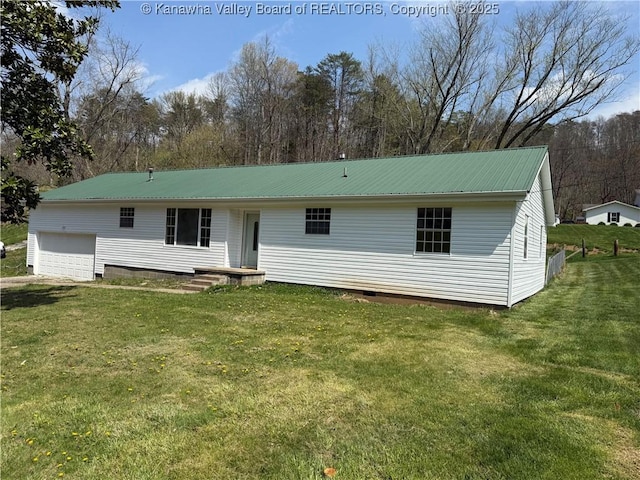 1651 Glenwood Rd, Milton, WV 25541 - back of property with a yard, metal roof, and crawl space