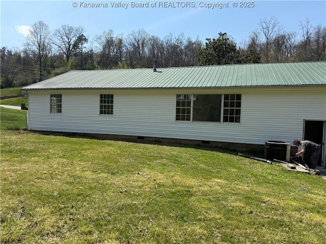 1651 Glenwood Rd, Milton, WV 25541 - rear view of property featuring a yard, crawl space, central AC unit, and metal roof