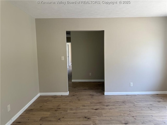 1651 Glenwood Rd, Milton, WV 25541 - spare room featuring baseboards and wood finished floors