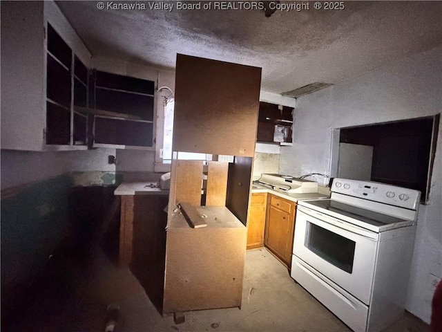 5806 Kanawha State Forest Dr, Charleston, WV 25314 - kitchen with concrete floors, electric stove, a textured ceiling, and open shelves
