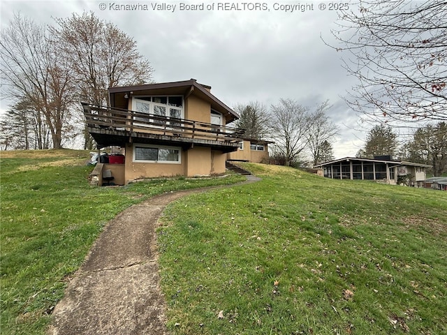 326 Skyline Dr, Charleston, WV 25302 - view of property exterior with stucco siding, a deck, and a lawn