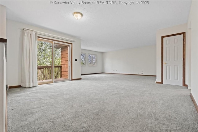 141 Wedgewood Rd, Ravenswood, WV 26164 - unfurnished living room with baseboards and carpet floors