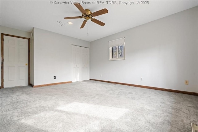 141 Wedgewood Rd, Ravenswood, WV 26164 - unfurnished bedroom featuring a closet, baseboards, ceiling fan, and carpet