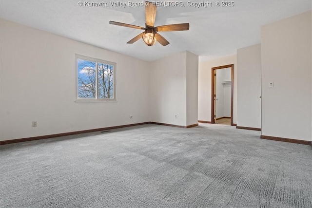 141 Wedgewood Rd, Ravenswood, WV 26164 - spare room featuring baseboards, a ceiling fan, and carpet flooring