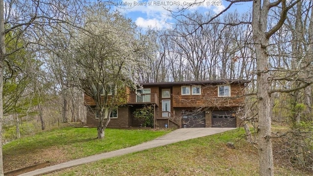 141 Wedgewood Rd, Ravenswood, WV 26164 - split foyer home with a front lawn, an attached garage, and driveway