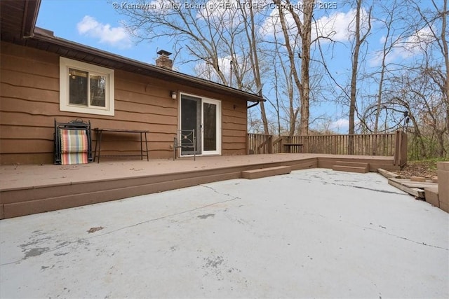 141 Wedgewood Rd, Ravenswood, WV 26164 - back of property with a chimney, fence, and a deck