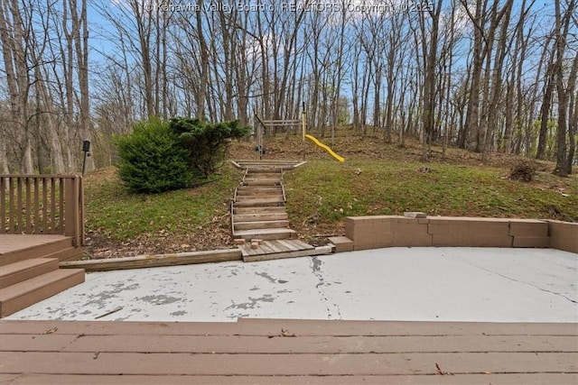 141 Wedgewood Rd, Ravenswood, WV 26164 - wooden terrace featuring a patio and playground community