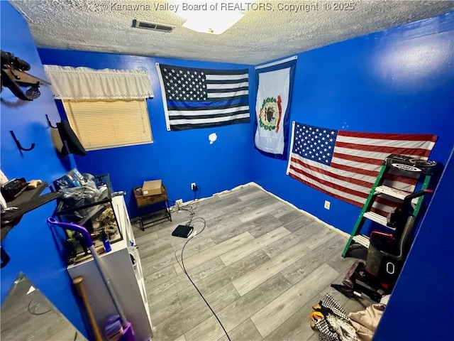 109 Cedar Ln, Saint Albans, WV 25177 - bedroom featuring visible vents, wood finished floors, and a textured ceiling