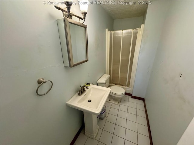 109 Cedar Ln, Saint Albans, WV 25177 - full bath with a textured ceiling, toilet, baseboards, walk in shower, and tile patterned flooring