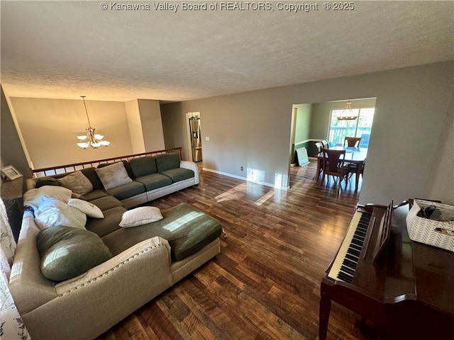 109 Cedar Ln, Saint Albans, WV 25177 - living room with wood finished floors, a chandelier, and a textured ceiling