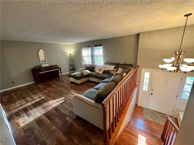 109 Cedar Ln, Saint Albans, WV 25177 - living area featuring baseboards, wood finished floors, a chandelier, and a textured ceiling