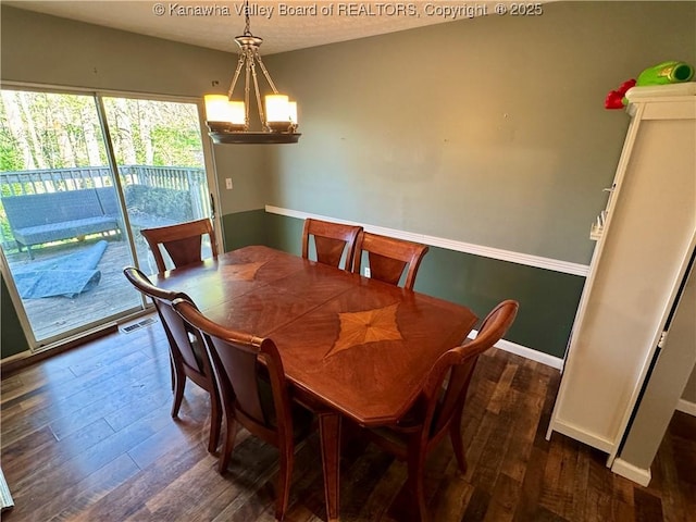 109 Cedar Ln, Saint Albans, WV 25177 - dining space featuring dark wood-type flooring, visible vents, baseboards, and an inviting chandelier