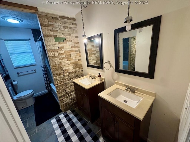 109 Cedar Ln, Saint Albans, WV 25177 - full bath with two vanities, a shower with curtain, a sink, and toilet