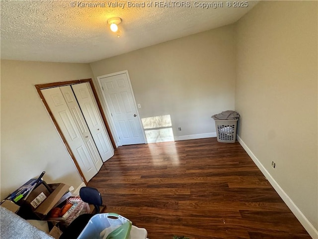 109 Cedar Ln, Saint Albans, WV 25177 - unfurnished bedroom with wood finished floors, a textured ceiling, and baseboards