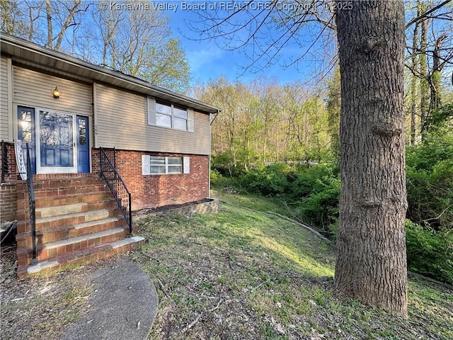 109 Cedar Ln, Saint Albans, WV 25177 - view of home's exterior with a lawn and brick siding