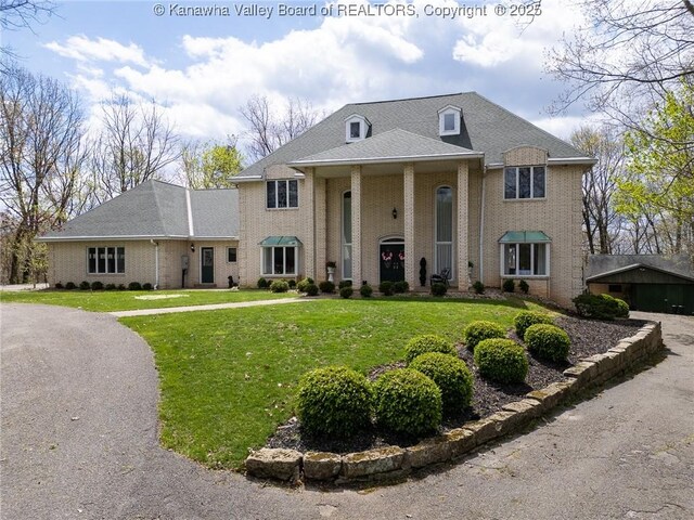 83 Lakeview Dr, Nitro, WV 25143 - greek revival inspired property with brick siding and a front lawn