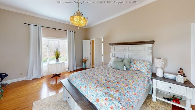 83 Lakeview Dr, Nitro, WV 25143 - bedroom featuring crown molding, light wood finished floors, and baseboards