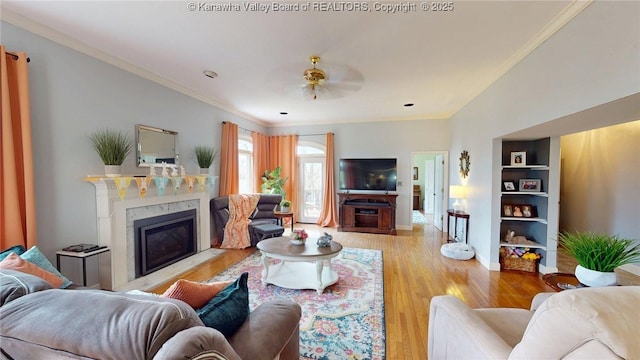 83 Lakeview Dr, Nitro, WV 25143 - living room featuring light wood finished floors, baseboards, a premium fireplace, ceiling fan, and ornamental molding