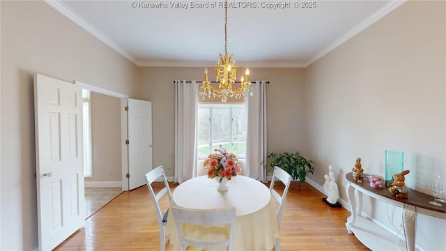 83 Lakeview Dr, Nitro, WV 25143 - dining space featuring a chandelier, light wood-type flooring, baseboards, and ornamental molding
