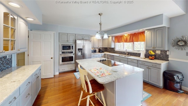 83 Lakeview Dr, Nitro, WV 25143 - kitchen with gray cabinets, stainless steel appliances, and a sink
