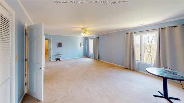 83 Lakeview Dr, Nitro, WV 25143 - interior space with light colored carpet, a ceiling fan, baseboards, and ornamental molding