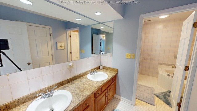 83 Lakeview Dr, Nitro, WV 25143 - bathroom with tile patterned floors, a sink, double vanity, and a bathing tub