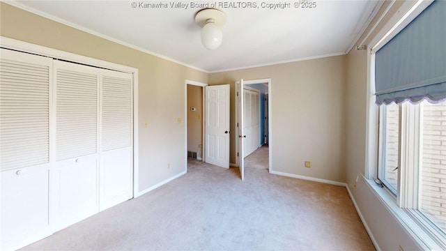 83 Lakeview Dr, Nitro, WV 25143 - unfurnished bedroom with baseboards, a closet, light colored carpet, and crown molding