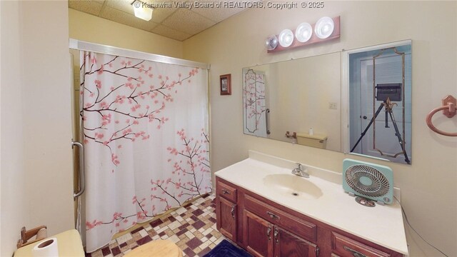 83 Lakeview Dr, Nitro, WV 25143 - full bathroom featuring vanity, a shower with shower curtain, and a paneled ceiling