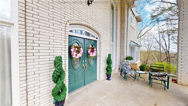 83 Lakeview Dr, Nitro, WV 25143 - property entrance with brick siding