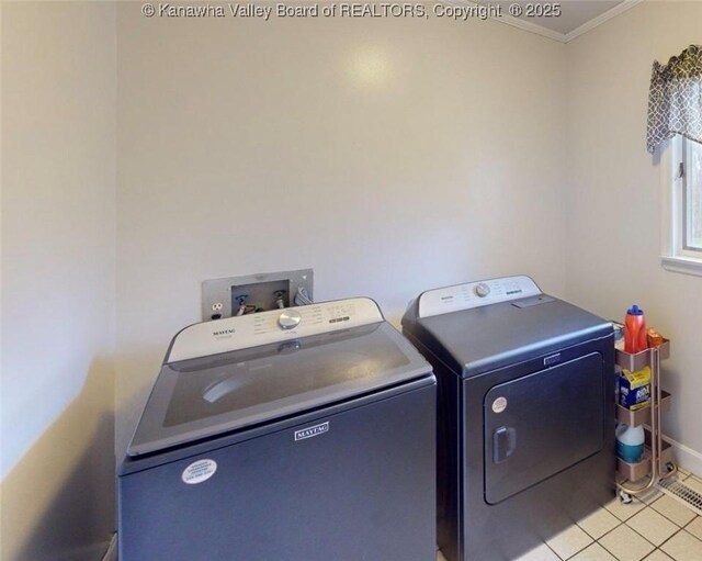 83 Lakeview Dr, Nitro, WV 25143 - laundry room featuring washing machine and clothes dryer, baseboards, ornamental molding, laundry area, and light tile patterned floors
