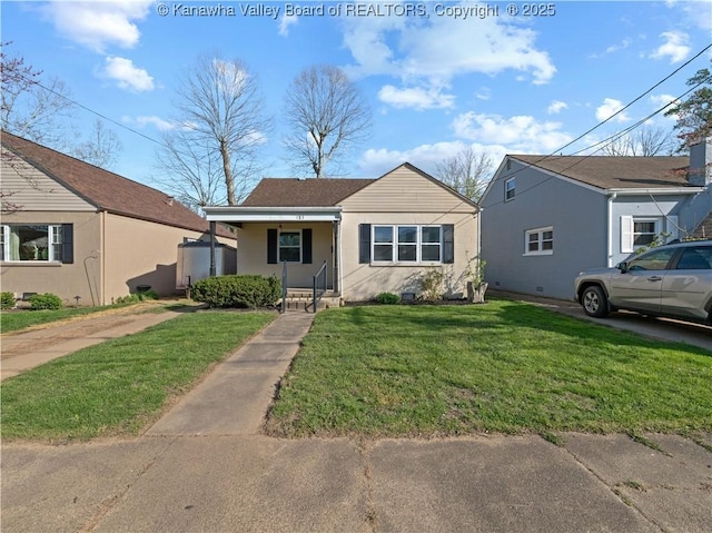 bungalow-style house featuring a front yard