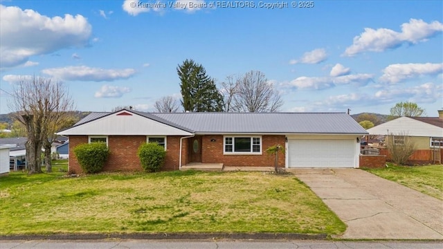 408 Fitzhugh St, Ravenswood, WV 26164 - single story home with metal roof, driveway, brick siding, a front yard, and a garage