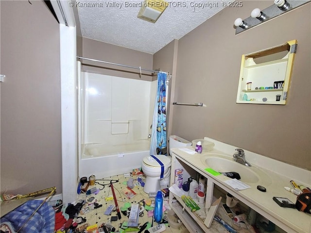 full bath with shower / tub combo, vanity, a textured ceiling, and toilet