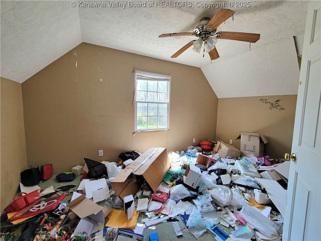 bonus room featuring lofted ceiling, a ceiling fan, and a textured ceiling