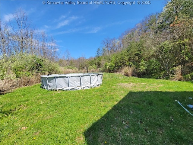 view of yard with an outdoor pool