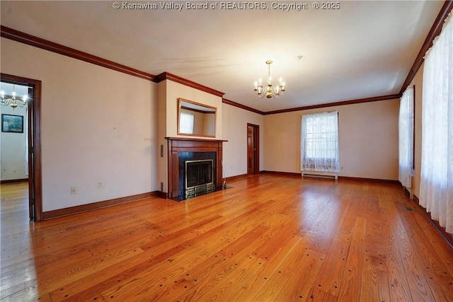 1055 Highland Dr, Saint Albans, WV 25177 - unfurnished living room with a fireplace with flush hearth, baseboards, a chandelier, and light wood-type flooring