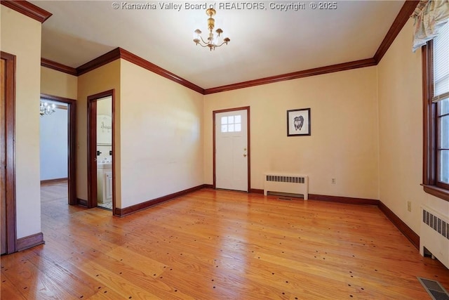 1055 Highland Dr, Saint Albans, WV 25177 - spare room featuring visible vents, an inviting chandelier, light wood-style floors, and radiator