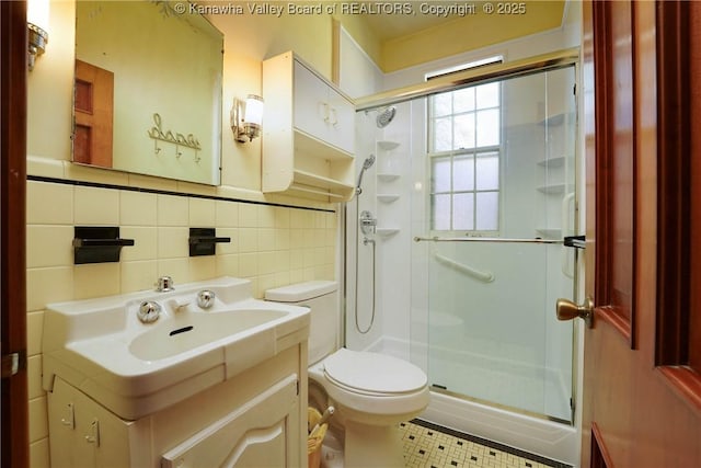 1055 Highland Dr, Saint Albans, WV 25177 - bathroom featuring toilet, tile walls, a stall shower, backsplash, and vanity