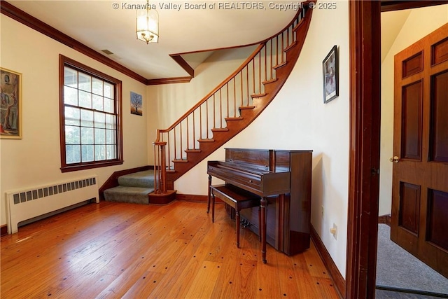 1055 Highland Dr, Saint Albans, WV 25177 - stairs with radiator, baseboards, crown molding, and wood-type flooring