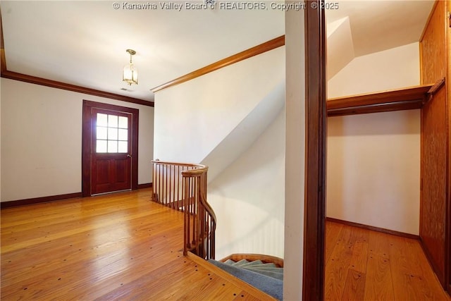 1055 Highland Dr, Saint Albans, WV 25177 - foyer with baseboards, crown molding, and light wood-type flooring