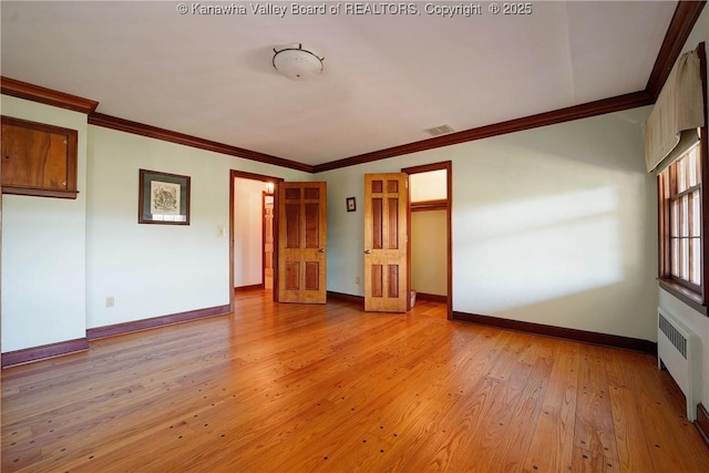 1055 Highland Dr, Saint Albans, WV 25177 - unfurnished bedroom with light wood finished floors, baseboards, visible vents, radiator heating unit, and ornamental molding