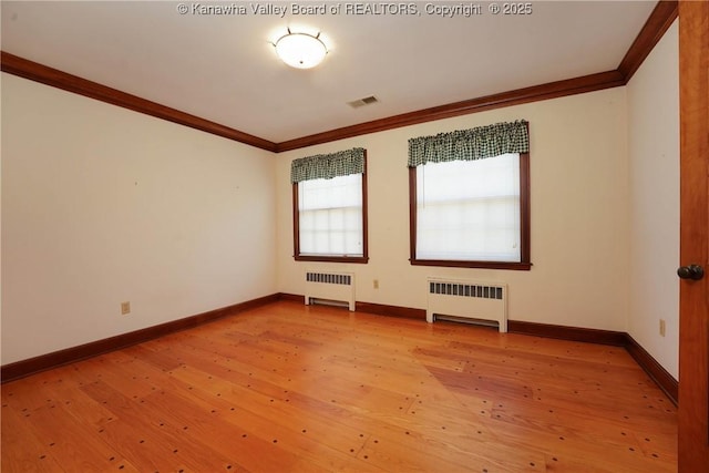 1055 Highland Dr, Saint Albans, WV 25177 - unfurnished room featuring crown molding, visible vents, light wood-style floors, and radiator
