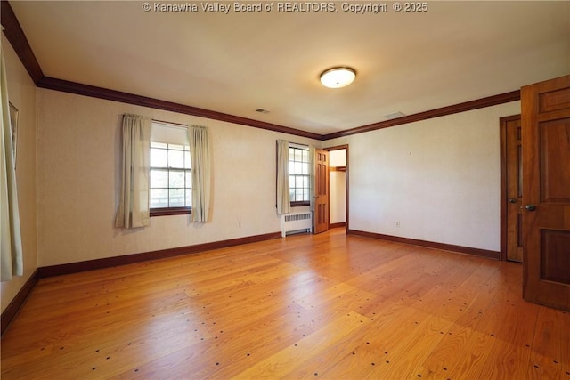 1055 Highland Dr, Saint Albans, WV 25177 - empty room with radiator heating unit, light wood-style floors, and crown molding