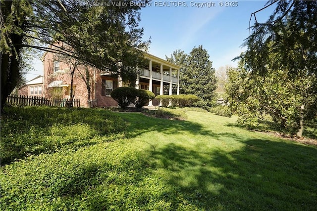 1055 Highland Dr, Saint Albans, WV 25177 - view of yard with fence and a balcony