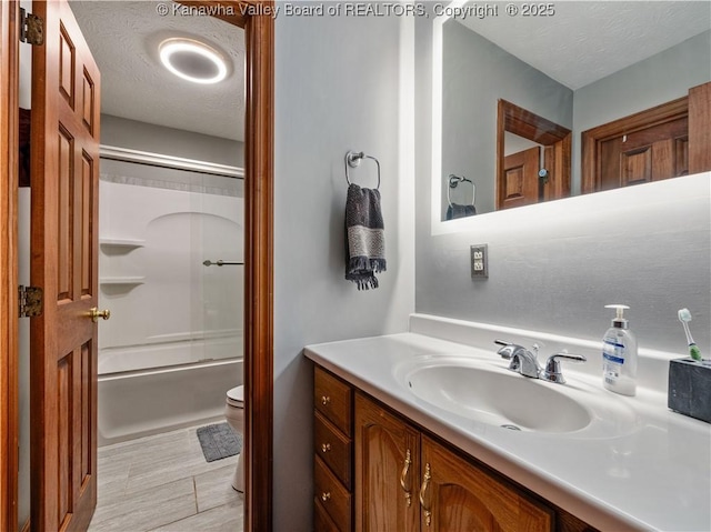 1205 Crown Point Dr, Hurricane, WV 25526 - bathroom featuring vanity, a textured ceiling, shower / bath combination with glass door, and toilet