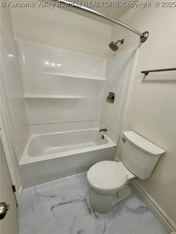 full bath with  shower combination, marble finish floor, baseboards, and toilet