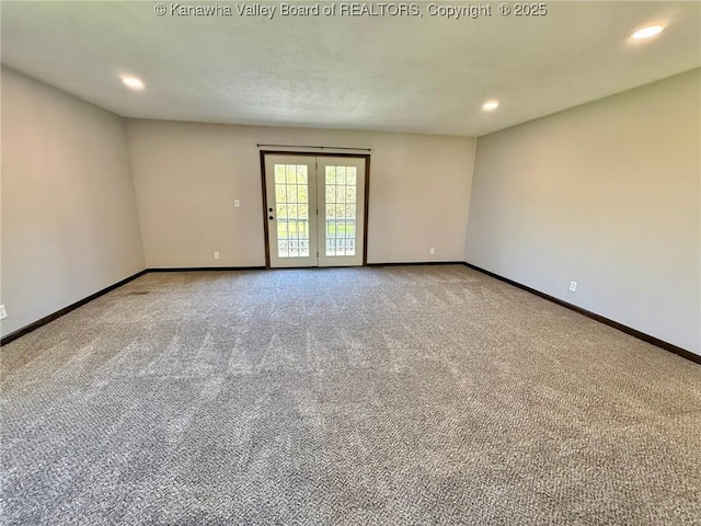 carpeted empty room with recessed lighting and baseboards
