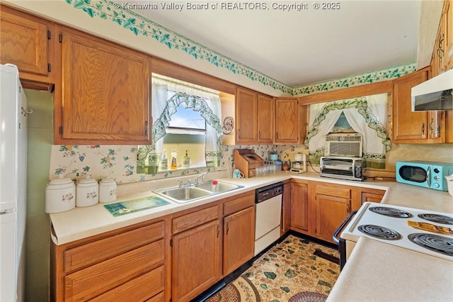 kitchen featuring a sink, extractor fan, white appliances, brown cabinets, and light countertops