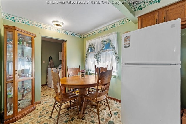 dining space featuring baseboards