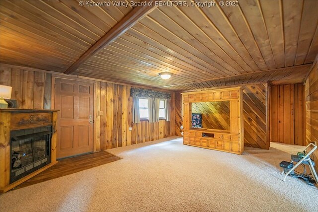 356 Joes Rd, Bomont, WV 25164 - unfurnished living room featuring wood ceiling, wood walls, and a fireplace